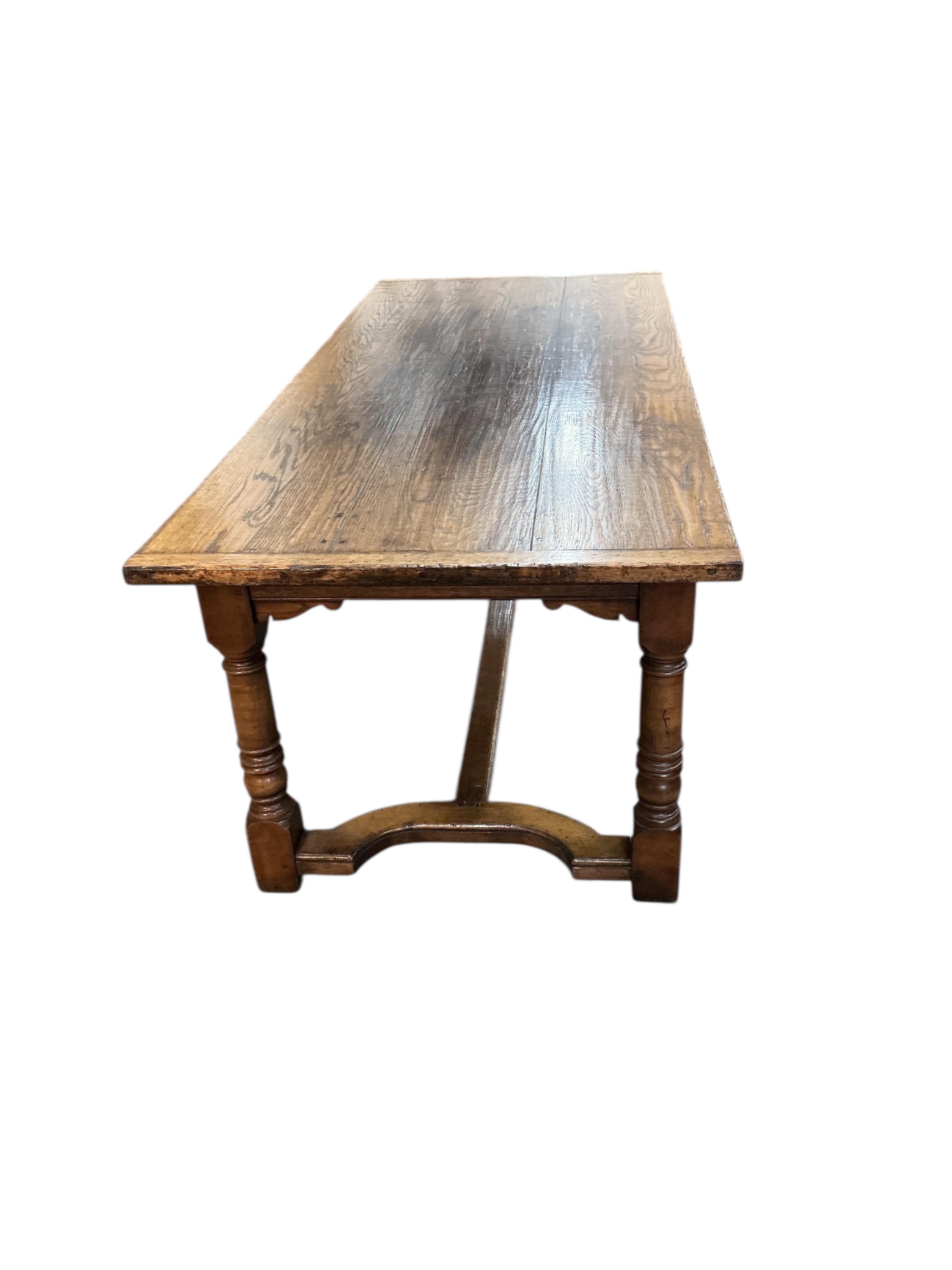 An 18th century style rectangular oak refectory dining table, width 214cm, depth 90cm, height 77cm together with six panelled oak high back dining chairs and two oak elbow chairs